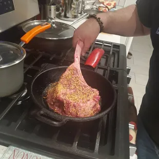 a person cooking on a stove