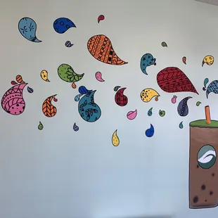 a coffee cup with a straw in it