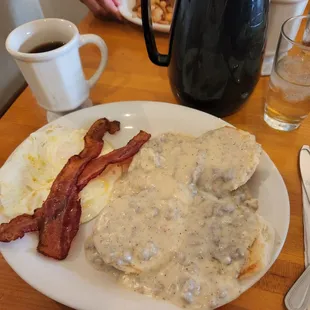 Eggs over easy with biscuits covered with sausage gravy.