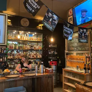  a woman behind the bar