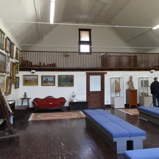 inside the large studio are numerous paintings by Steele