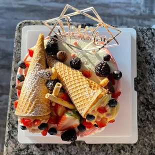 a plate of waffles and berries