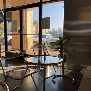  a table and chairs in a coffee shop