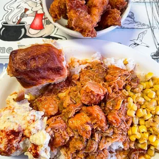 a plate of pulled pork and corn