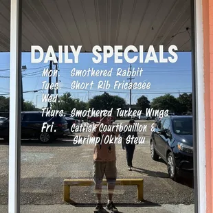 the reflection of a man in the window