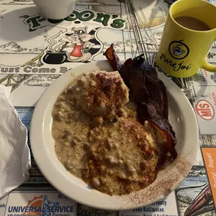 Biscuit &amp; gravy with a side of bacon . . . It tastes a lot better than it looks.