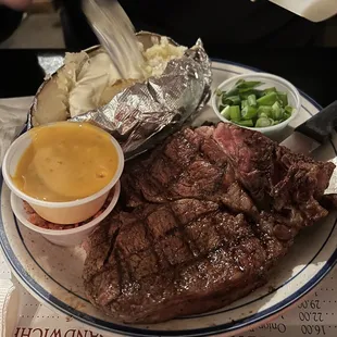 Ribeye and loaded baked potato. They let you choose between shredded cheese or nacho cheese for your baked potato.