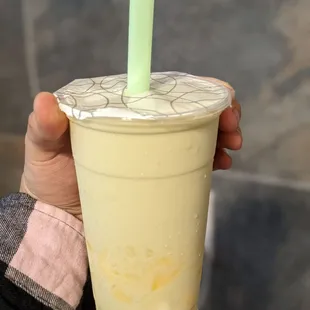Large honeydew milk tea with house pudding and milk pudding