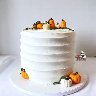 ws a cake decorated with pumpkins