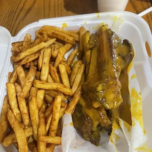Ribs 3 da hard way and fries.