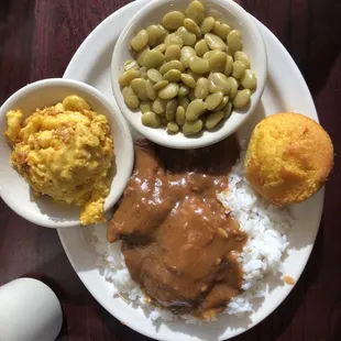 Country style steak with mac and cheese, Lima beans, and cornbread.