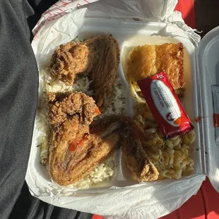 Already eaten fried chicken platter with corn bread rice and Mac and cheese