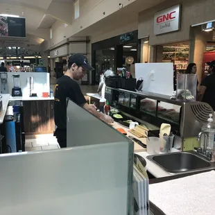a man preparing food in a restaurant