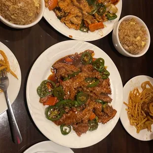 a table full of chinese food