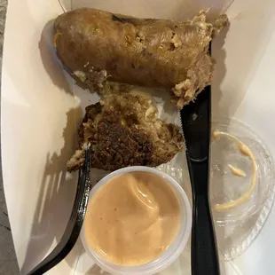 Boudin sausage and crawfish boudin ball (both cut in half)