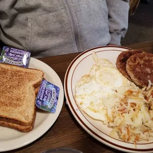 Sausage eggs hash Browns in  Wheat toast.