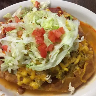 Navajo taco with chicken and both chilies.