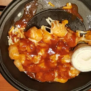 Loaded tater tots very very very small portion for 7.99 what a joke. I guess take out a screw you on the portions