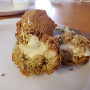 Cheesy filling in the boudin balls- so good.