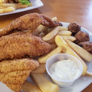 Catfish with big steak fries and bomb hush puppies