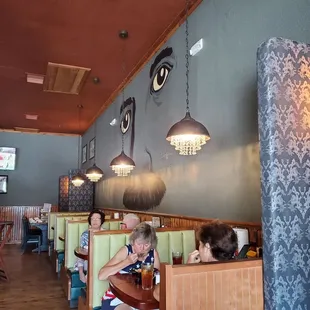 people sitting in booths