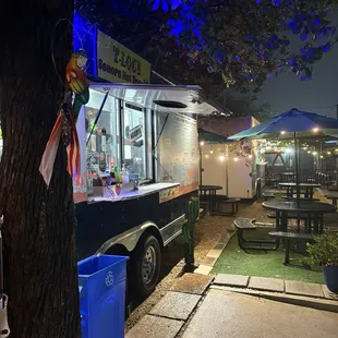 Food truck found in a parking lot surrounded by food trucks