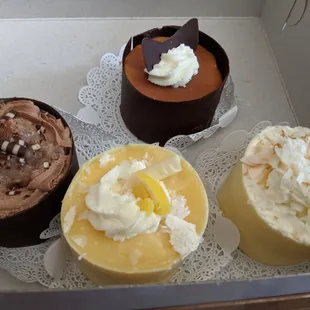 Individual desserts. Clockwise from top: Tuxedo, Coconut, Lemon velvet and German chocolate