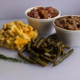 Delicious sides. ( mac, yams, baked beans , and special  herb flavored green beans