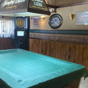 a woman playing pool