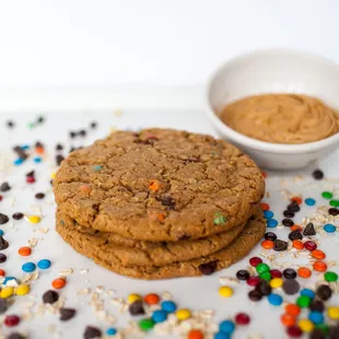 a cookie and a bowl of peanut butter