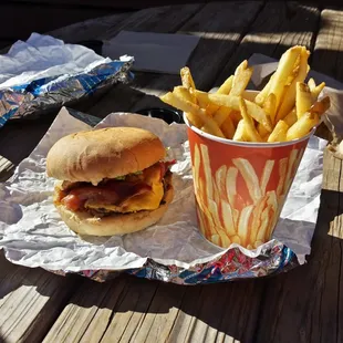 Bacon cheese burger $11.50. Fries $4.50. A decent size portion for resort food.