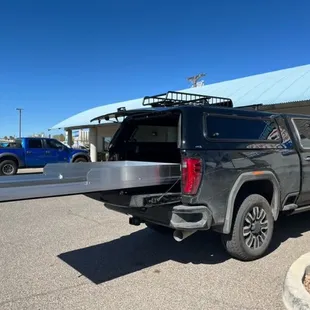 We installed this ARE Evolve shell with Yakima racks and skinny warrior basket. Also installed the Cargo Glide with high sides.
