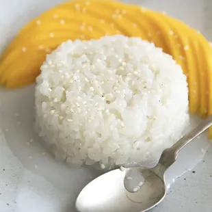  a plate of rice and mangoes