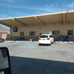 a white car parked in a parking lot