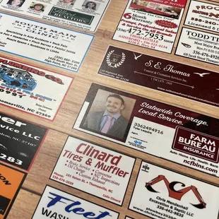 a variety of business cards on a table
