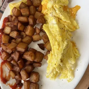 Scrambled eggs w cheese and crispy home fries!