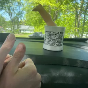 Thumbs, a cup, and a baby leg