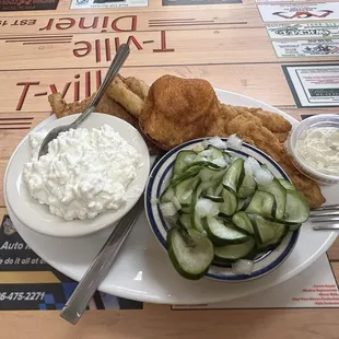 Build-your-own lunch/dinner plate special (selections change daily). Fried fish, cucumber salad, cottage cheese, cornbread, &amp; tartar sauce.
