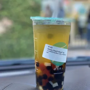 a cup of tea on the dashboard of a car
