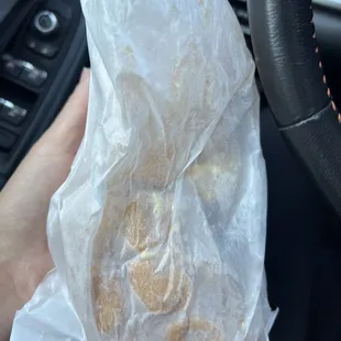The paperbag is all wet.. they stuffed this into a plastic bag instead of letting the steam out.