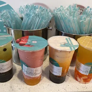 Mango Milk Tea w/boba, Strawberry Lemonade Slush w/mango popping boba, Thai Milk Tea w/boba and Passion Fruit Royal Tea w/rainbow jelly