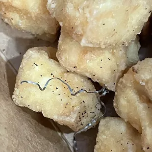 Steel wool strand on fried tofu