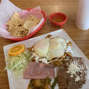 Fresh chips and salsa, Chilaquiles and Tamarindo drink