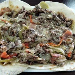 Alambre plate.  Carne asada, bacon, peppers, onions and cheese on top of 5 tortillas.  So bomb!