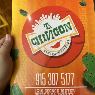 The front of the menu with the address and phone number