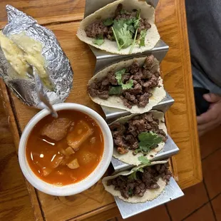 Tacos Asada, baked potato, and charro beans