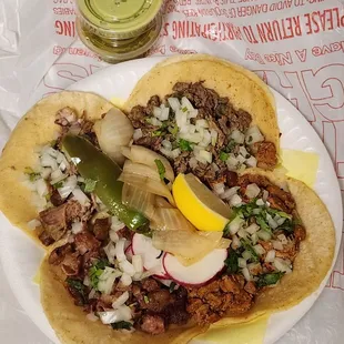 Tacos de Carnitas, Asada, Pastor y Tripas (clockwise)