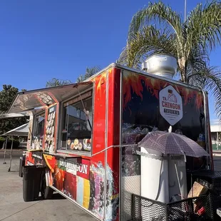 a taco truck parked in a parking lot