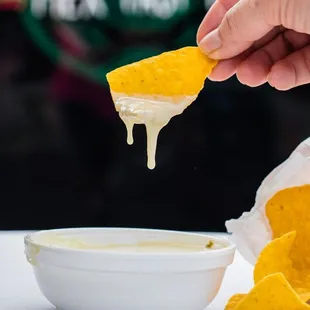 Chips and Cheese dip: Homemade fried corn chips with melted cheese.