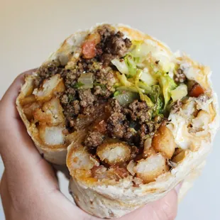 Cheeseburger &amp; Fries burrito: Flour tortilla, crinkle fries, ground beef, cheese, lettuce, mustard, ketchup and mayo.